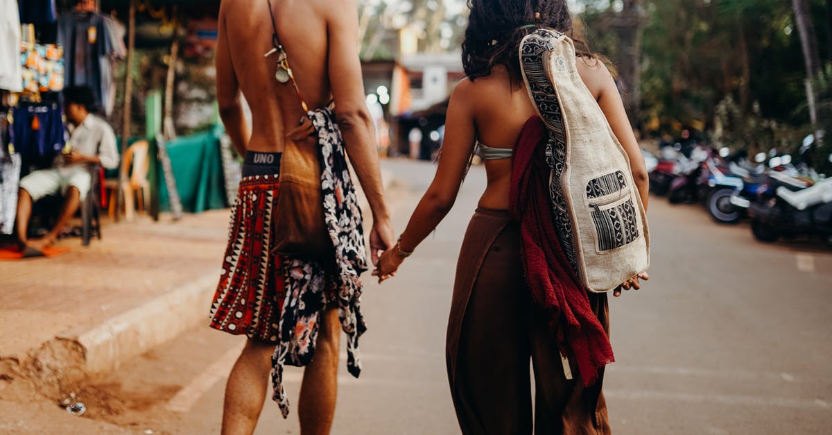 Flying back to Europe from India with passport that does not have 6 months till expiry date for EU citizen - Photo of Couple Walking While Holding Hands