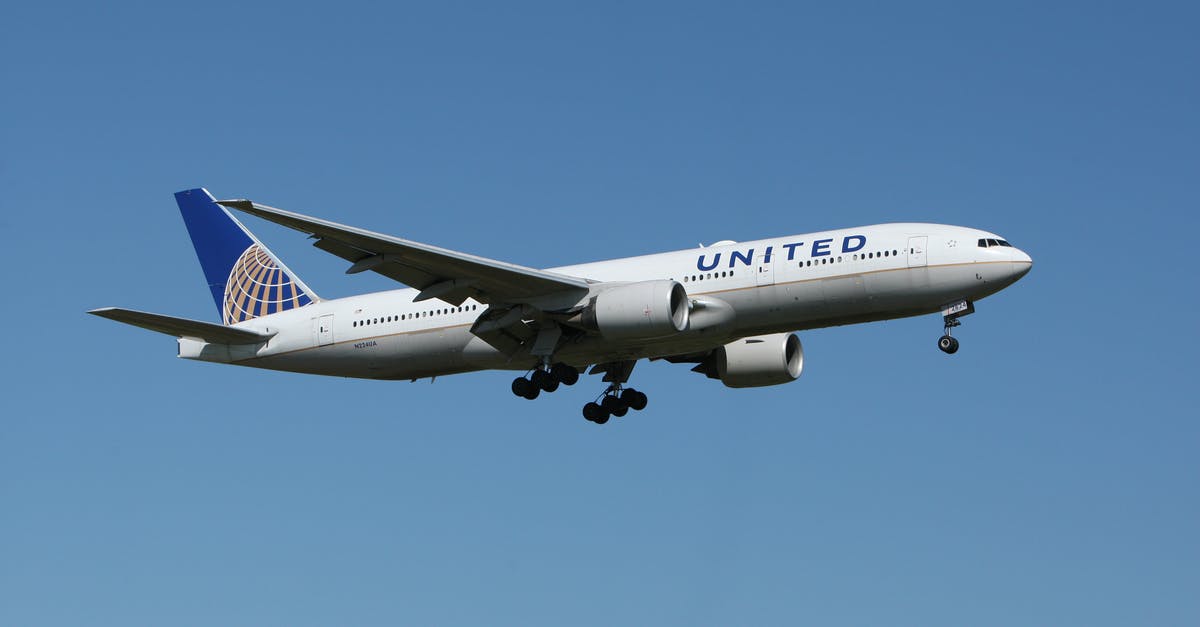 Flying into one airport and leaving from another - White United Airlines Plane