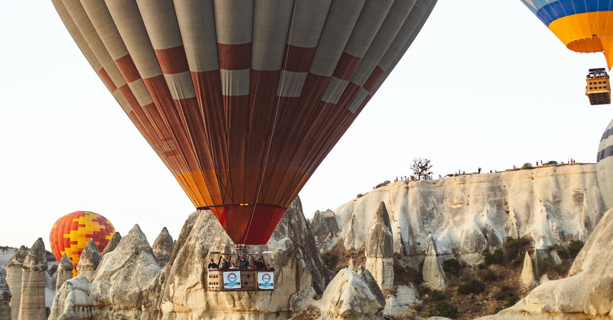 Flying to Scotland with Irish Visa - Hot Air Balloons Flying over Mountains