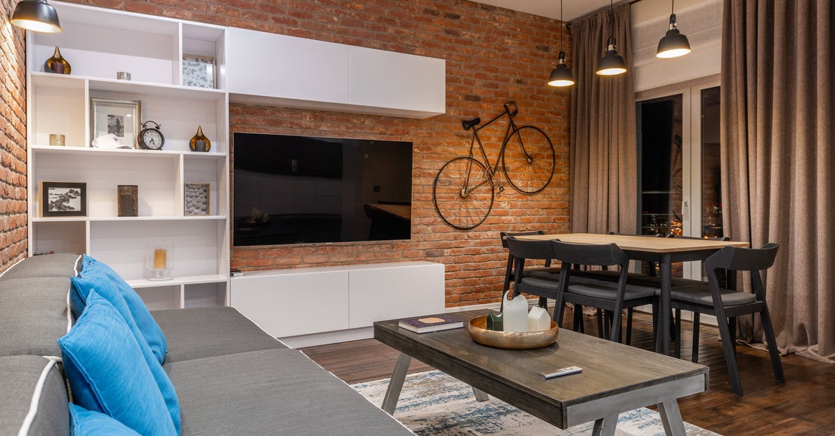 Flying with a folding electric bike? - Modern loft room interior with furniture and TV at home