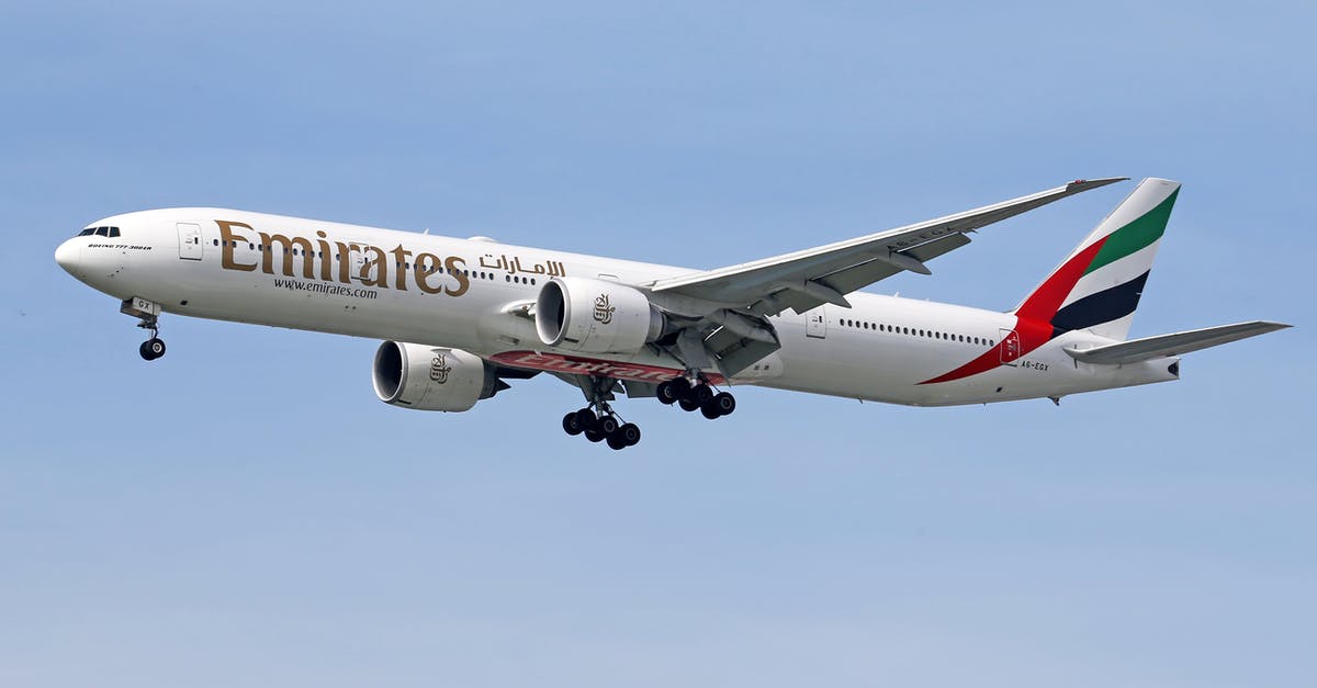 Flying with Emirates and confused about luggage - White and Red Passenger Plane in the Sky