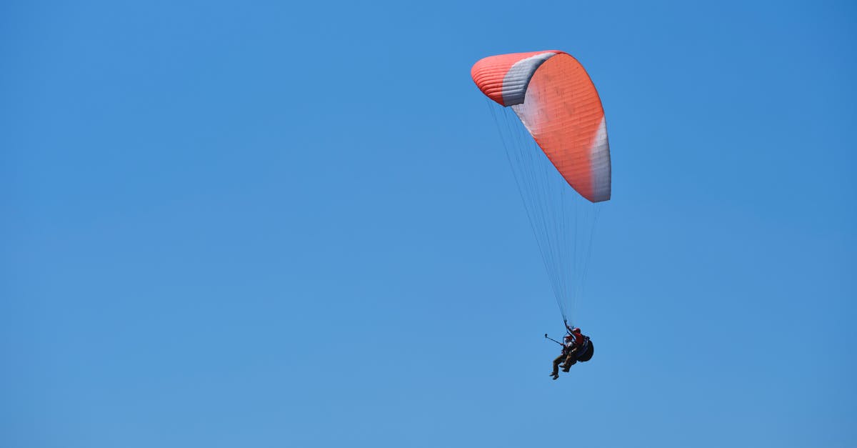 Flying with marijuana - paragliding and blue sky background