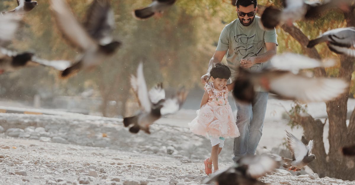 Flying with someone else's children - Man Holding Girl