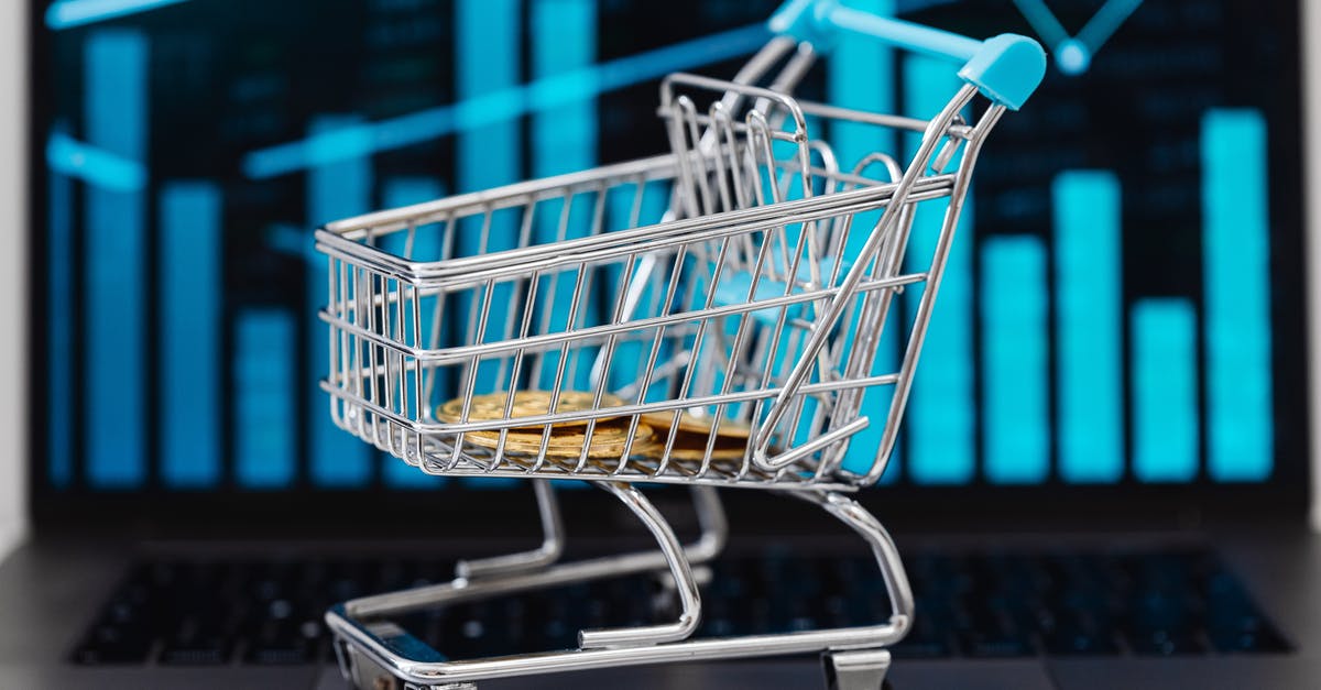 Flying With Uncharged Laptop - Blue Shopping Cart on White Floor