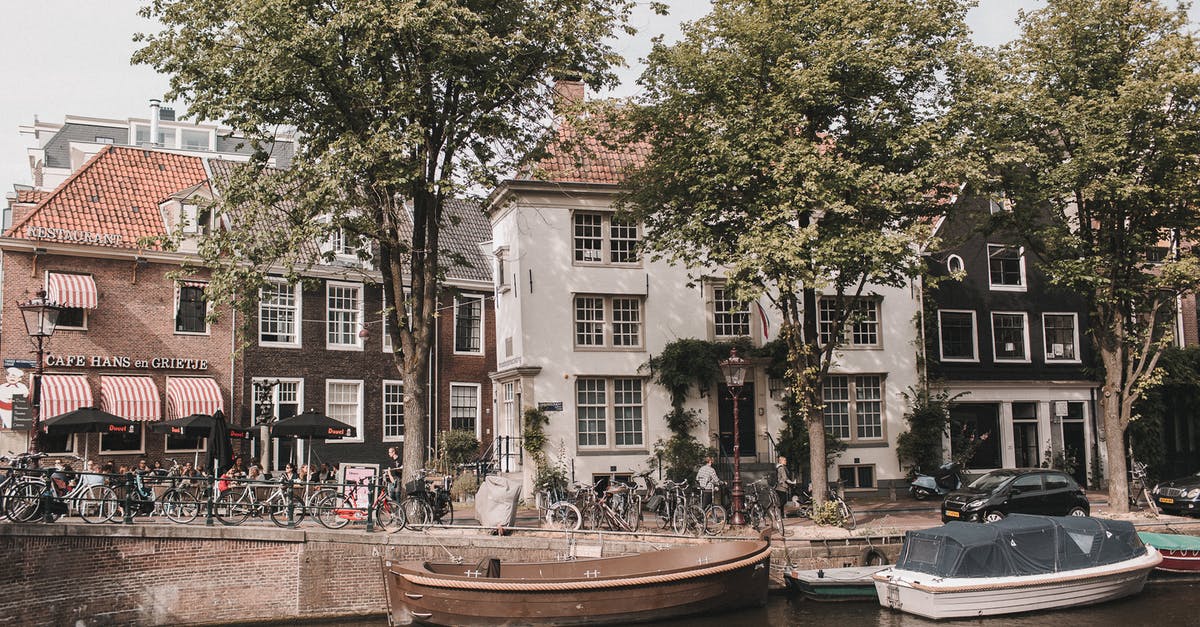 Folding bicycles on Netherlands trains - Brown Boat on Dock Near Green Trees