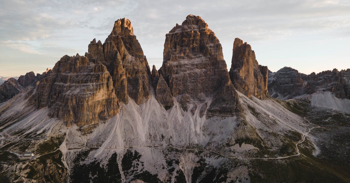 Following in the Footsteps of Hemingway in Italy - Snow Covered Mountain Under Cloudy Sky