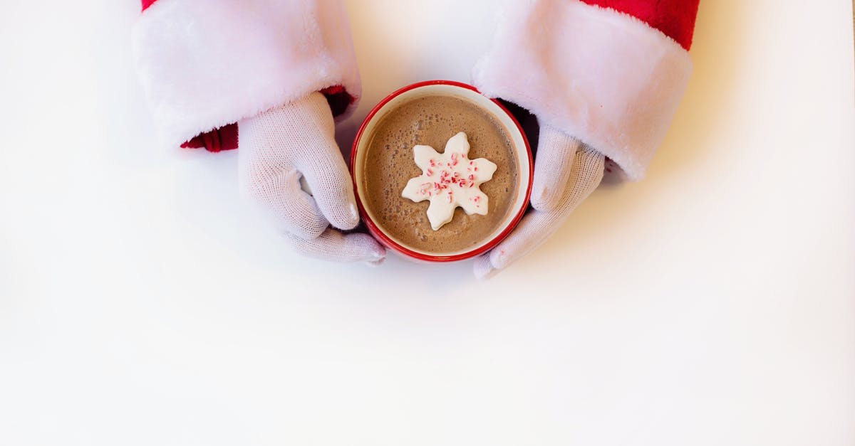 Food Across CA-US Border [duplicate] - Person Wearing White Gloves Holding Cup of Hot Cocoa