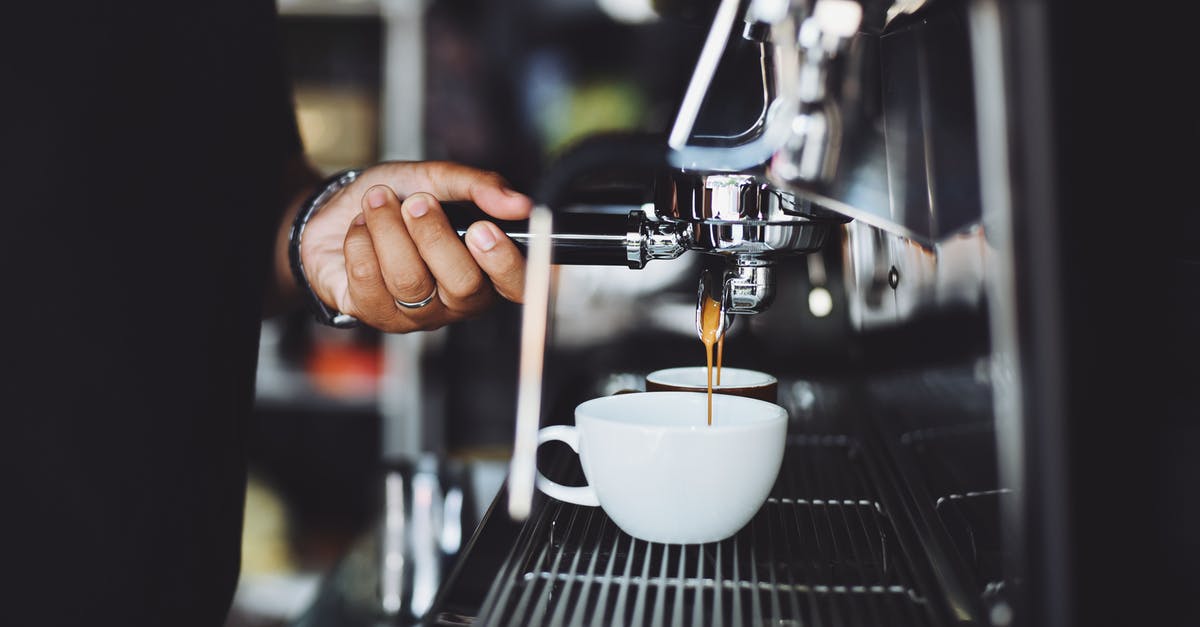 Food or drinks on VTA Light Rail - Close-up of Hand Holding Coffee Machine