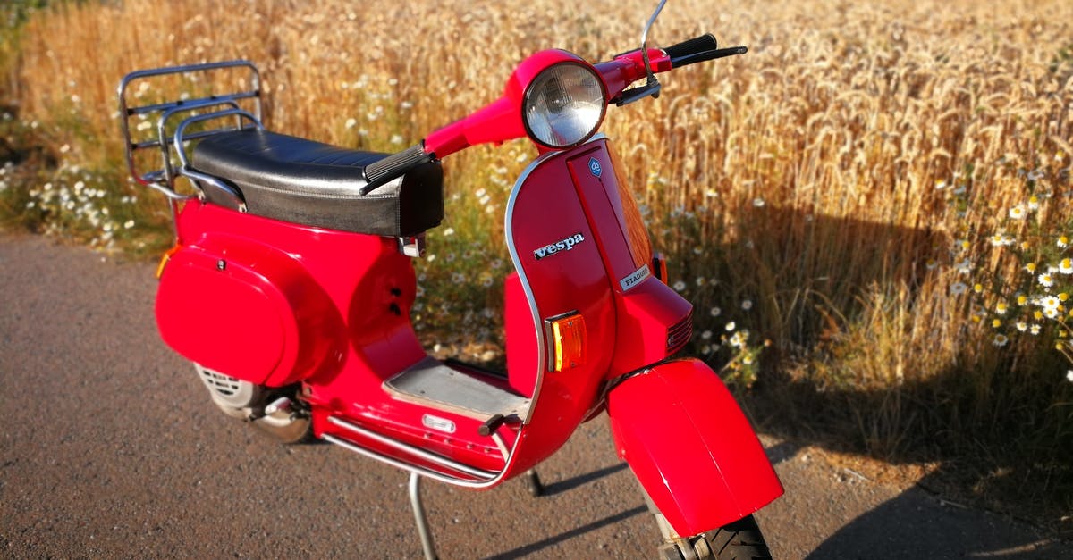 Foreign motorcycle licence in Costa Rica at 16 - Red Motor Scooter on Brown Field