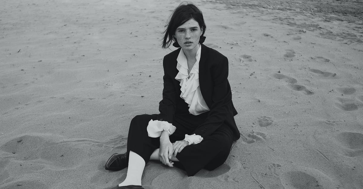 Formal Obligation [closed] - Young Woman in Formal Outfit Sitting on Beach