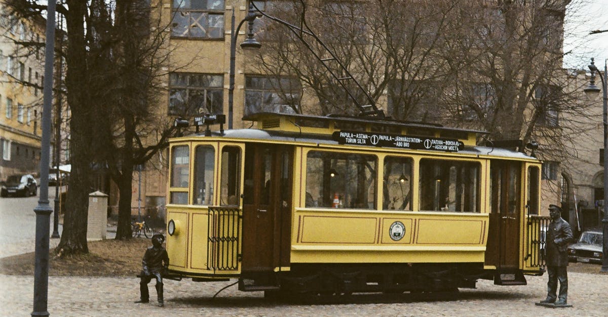 Former Gulag camps in Russia - Yellow and Black Tram on Road Near Bare Trees