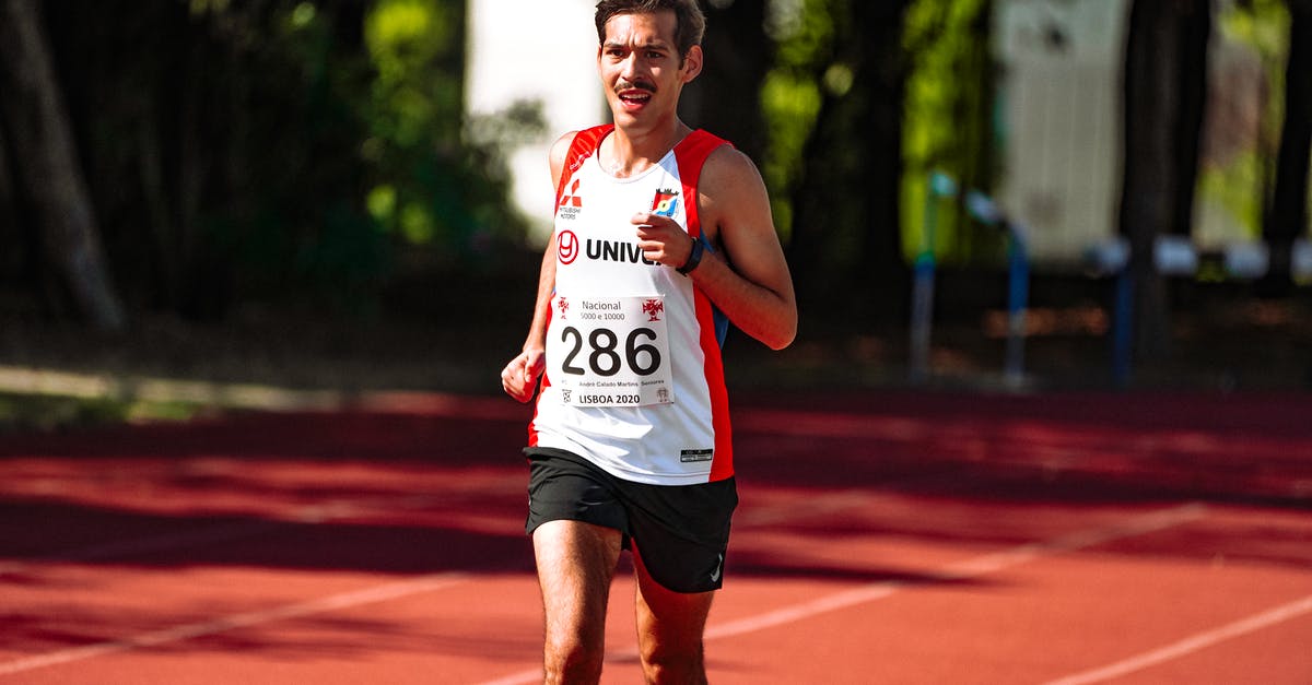 Forwarding a Canadian number abroad? - Fit athlete running on race track during competition