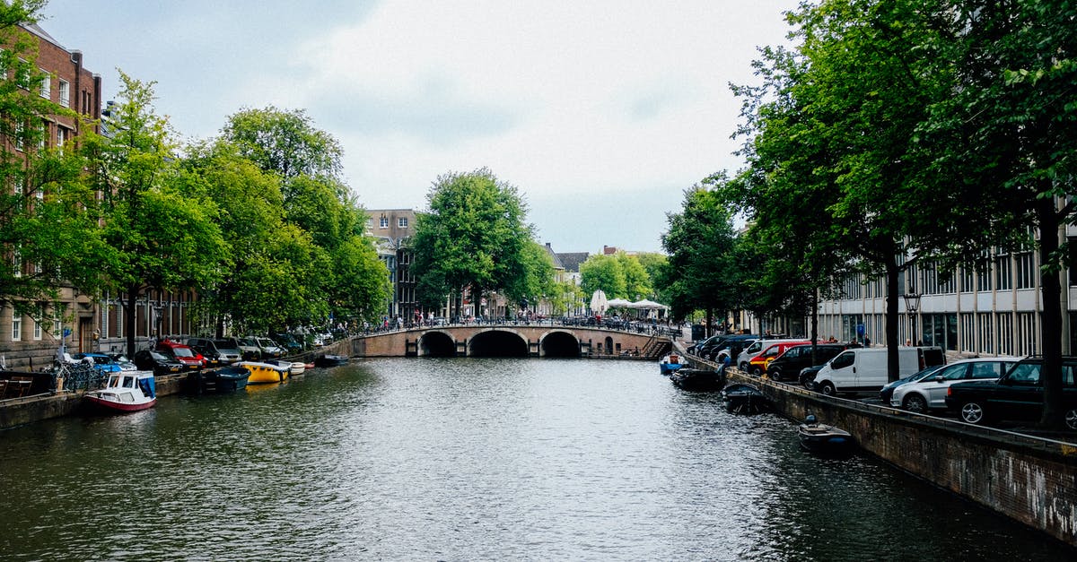 Four trip discount on Netherlands trains? - City district with beautiful canal and pedestrian bridge