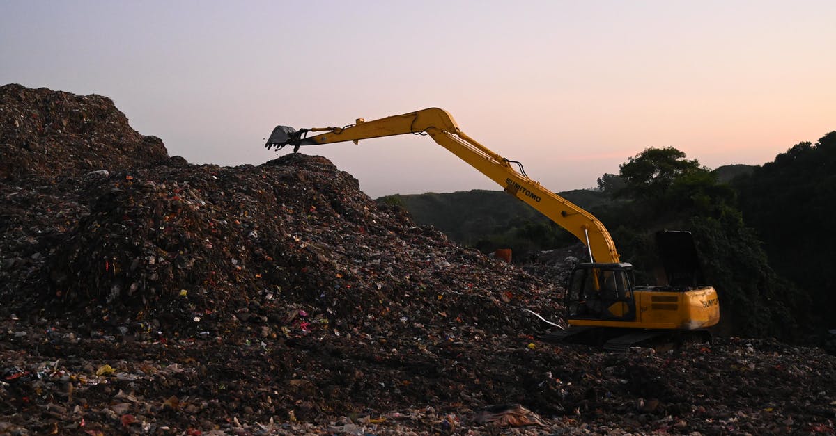 Free RV dump sites—what's the catch? - Excavator on Work on a Landfill 