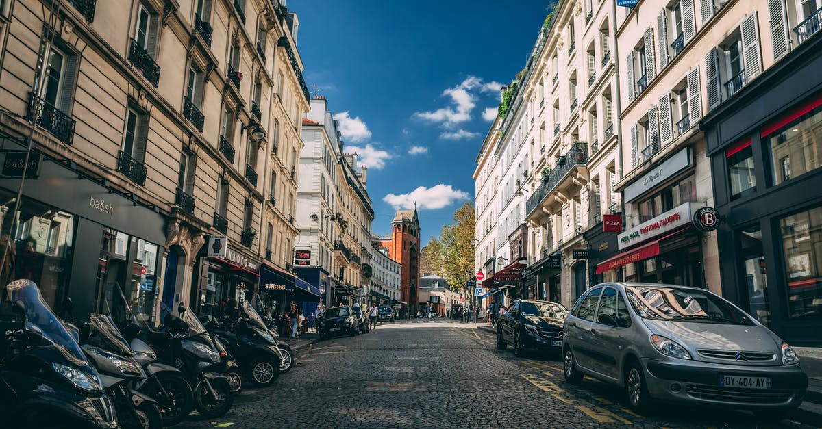 Free street parking in Paris - Photo of Motorcycles and Vehicles Parked on Road