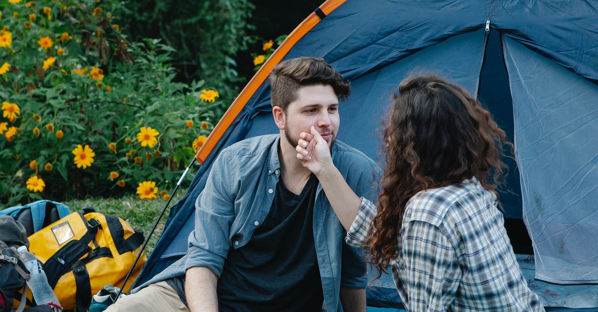 Free tent camping location close to Adelaide? - Young woman touching face of boyfriend during romantic picnic in nature