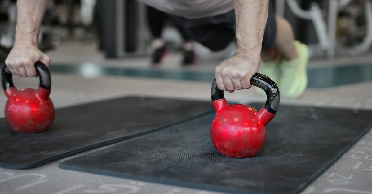 Free Wi-Fi / available power / cashless food facilities in LAX airport? - Muscular sportsman doing plank exercise on kettlebells