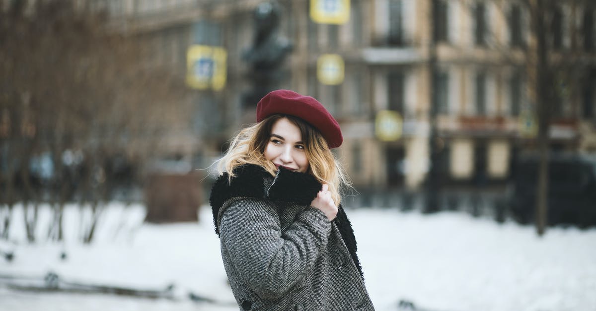 French Pyrenees: Travel from Montréjeau—Gourdan-Polignan to Bagneres de Luchon - Woman Wearing Coat and Red Hat during Snowy Day