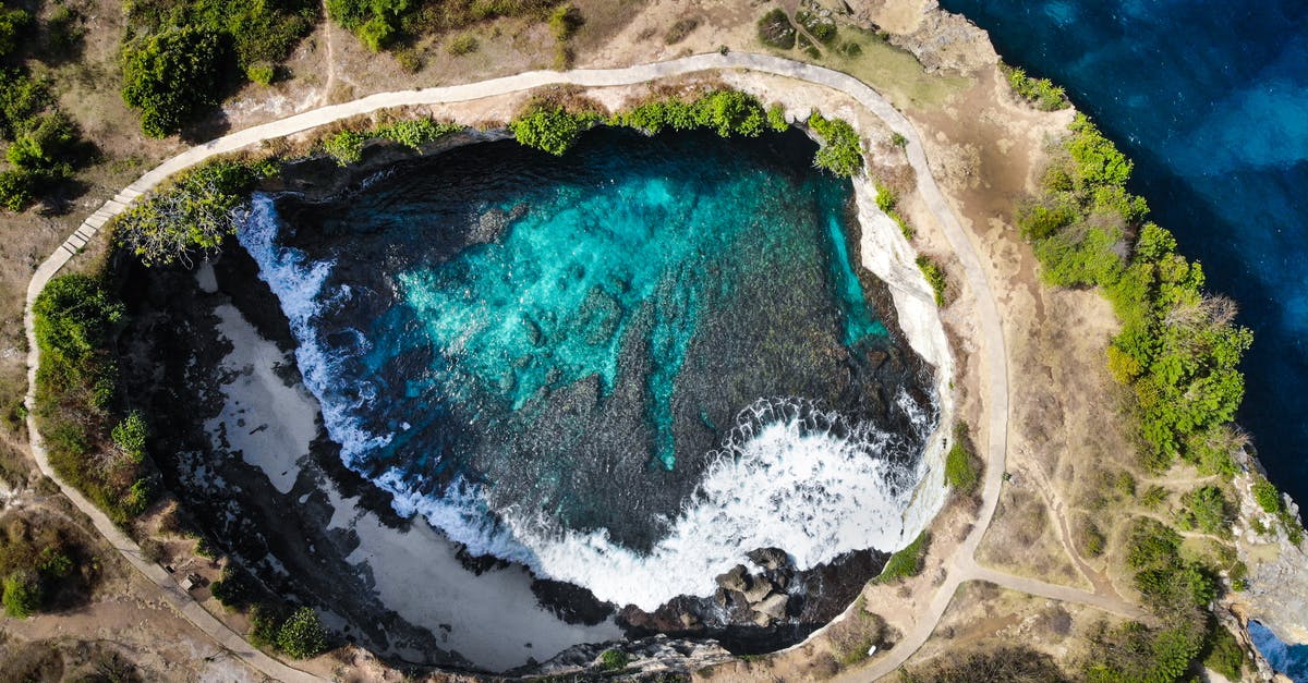 From Bali to Jakarta by bus and ferry how to? - Aerial PhotO of Hole Near Sea With Clear Body Of Water