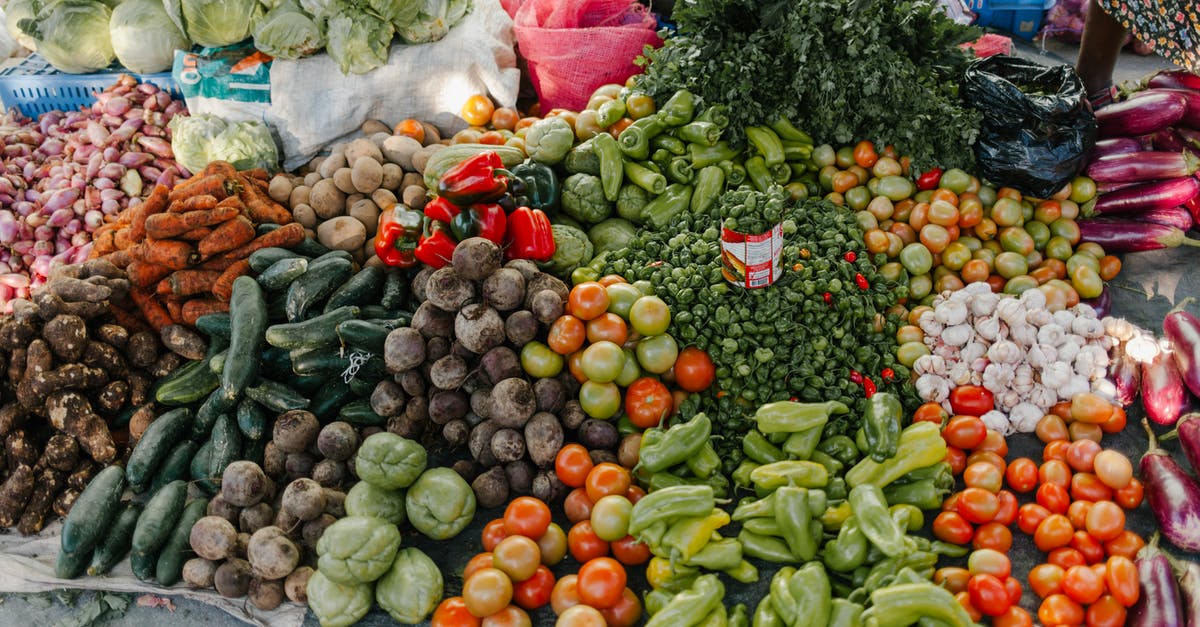 From Hiroshima to Fukuoka via local trains - From above of various vegetables including pepper beets cabbage tomatoes greens potato zucchini and carrot at bazaar