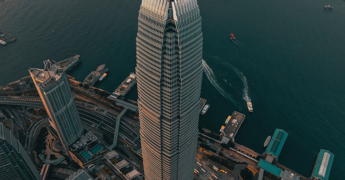 From Shenzhen to Hong Kong as a Western traveller? - Geometric skyscraper located in city downtown at seafront