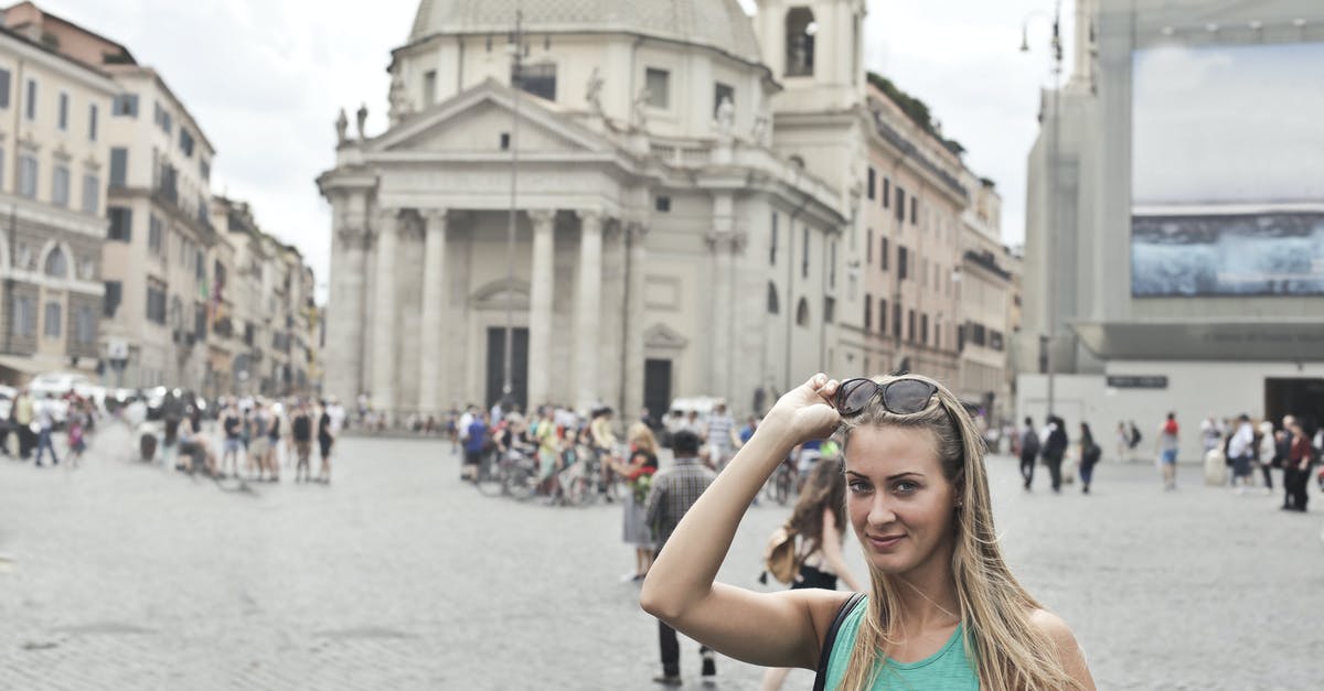 Gambian in Italy wants to visit UK [duplicate] - Stylish young female tourist in casual wear with sunglasses smiling and looking at camera while standing on old square Piazza del Popolo during summer holidays in Rome