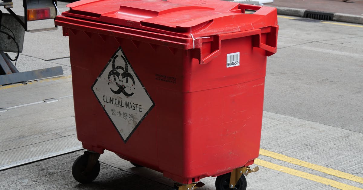 Garbage bin on Khao San Road, Bangkok - A Red Plastic Garbage Bin for Clinical Waste