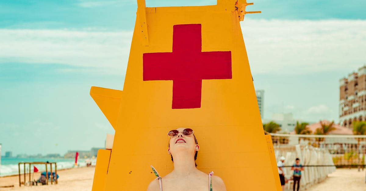 General security concerns about Cancun, Mexico - Shallow Focus Photo of Woman Standing Near Lifeguard Tower