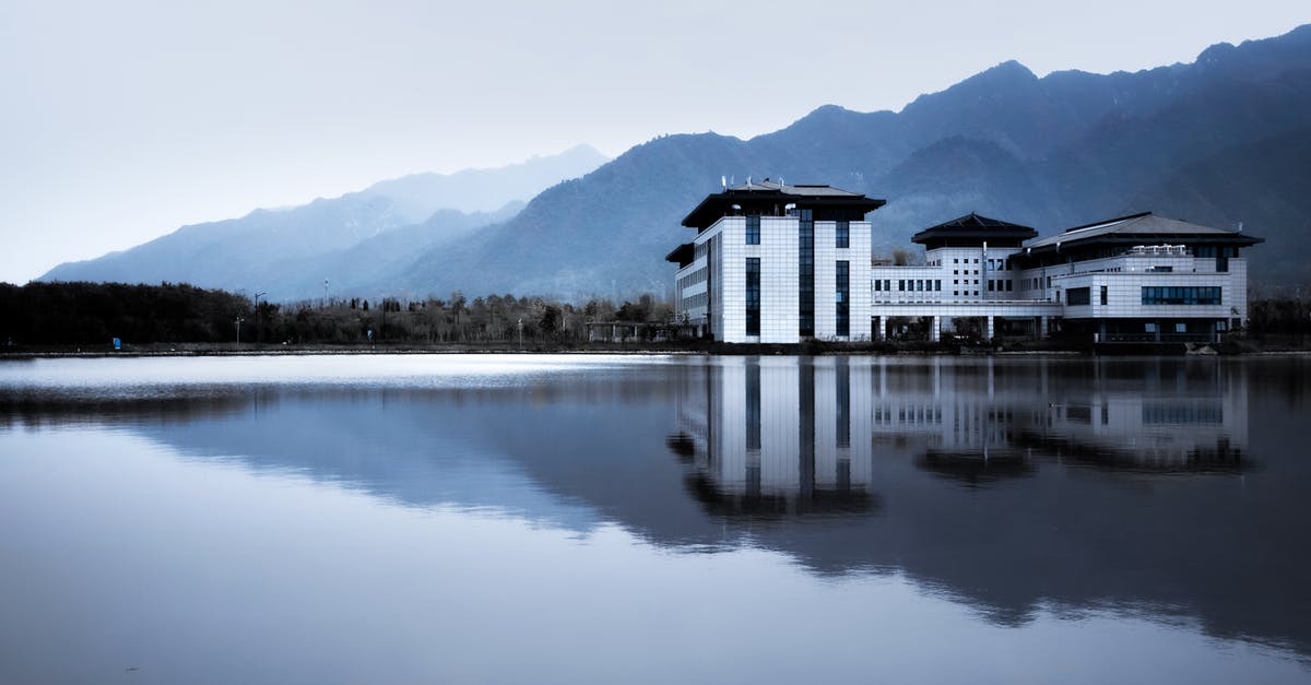 German hotel asking cancellation fee - Landscape with Mountains, Lake and Hotel