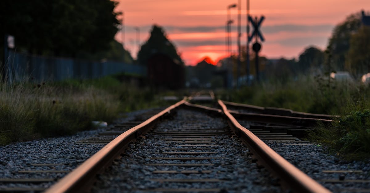 German Rail Pass - Shallow Focus Photography of Railway during Sunset