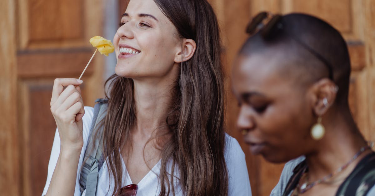 Germany Visiting Friends Visa Remonstrance Denied - Woman in White Shirt Holding Yellow Lollipop