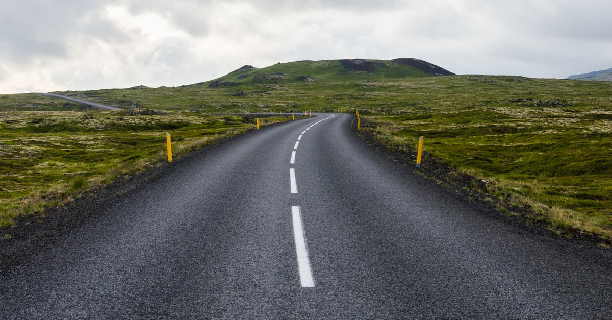 Get a driving license abroad without one from your country of residence? - Gray Concrete Road Towards Green Mountain