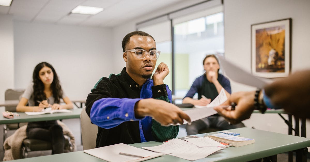 Getting a TB test to stay in UK [closed] - Student Getting His Test Paper