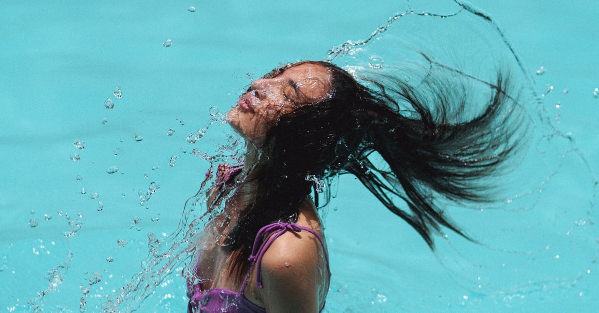 Getting around on Kyushu (Fukuoka, Nagasaki and Beppu) - Slim waving hair in blue water of resort pool