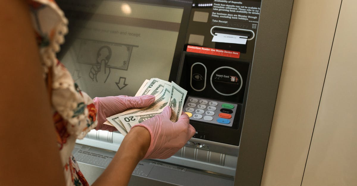 Getting cash from ATM at MEX airport - Person Counting Money in front of ATM