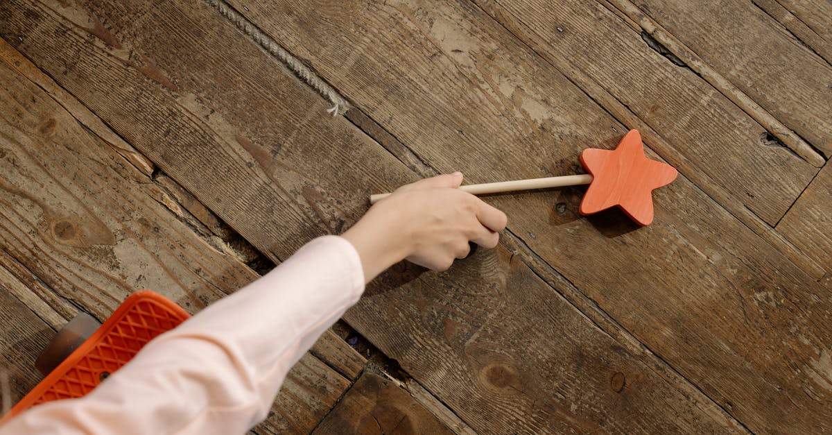 Getting from Chiayi to Alishan through Fenqihu on a Sunday - A Hand Picking the Wooden Wand on the Floor