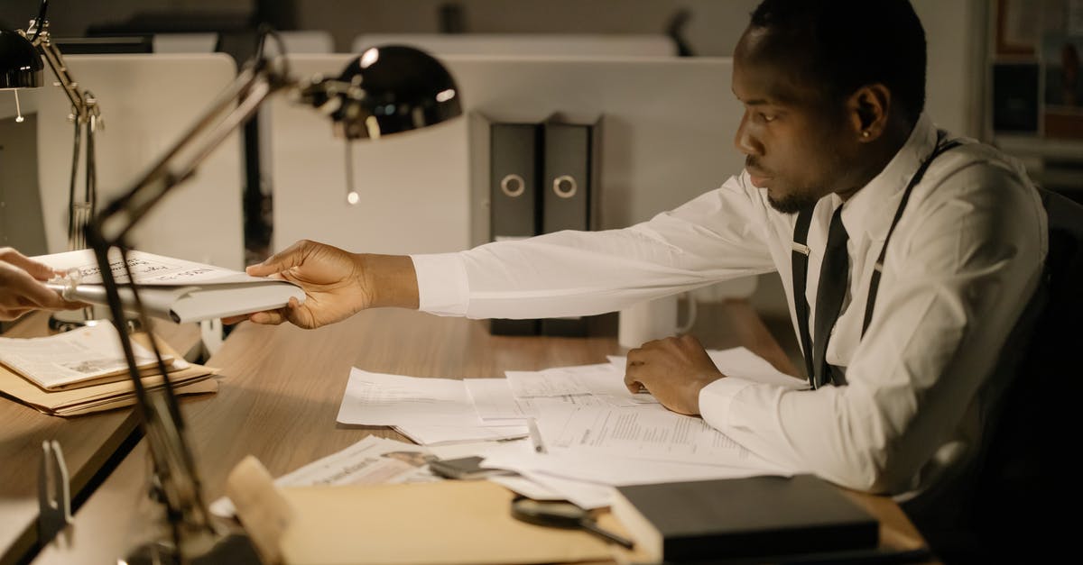 Getting national visa after getting Work permit in Germany [closed] - A Man Getting Papers to a Person