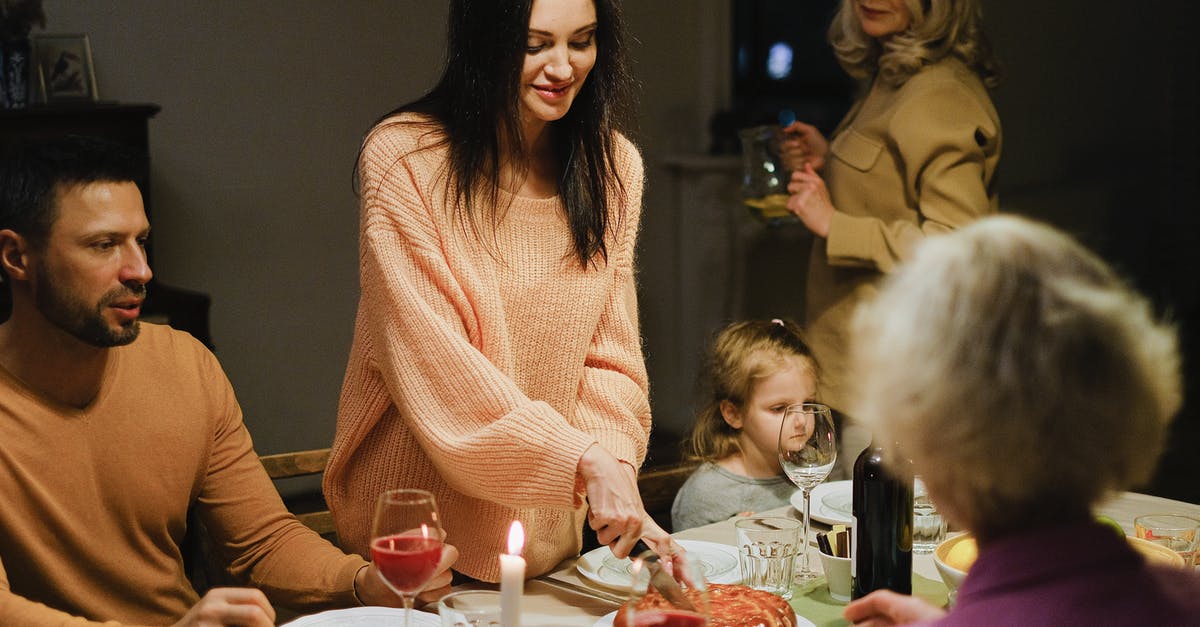 Getting to Laulupidu – Estonia - A Woman Slicing a Pie at a Dining Table