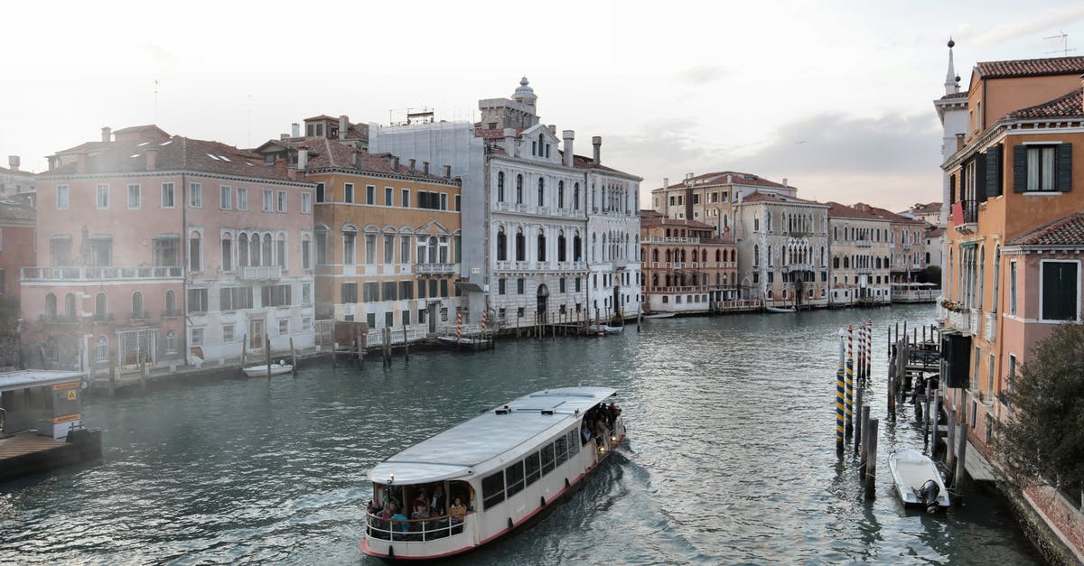 Getting to Mexico City Airport early in the morning - Venice waterway with old buildings and ferry