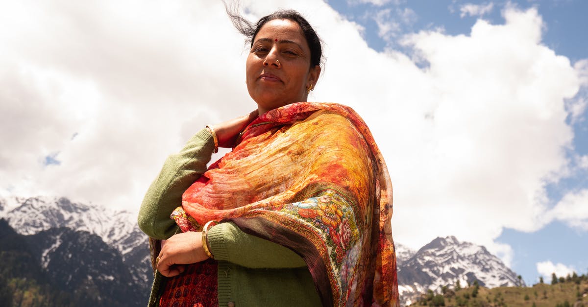 Getting to Shatili village from Tbilisi? - Positive ethnic female resting in village near mountains