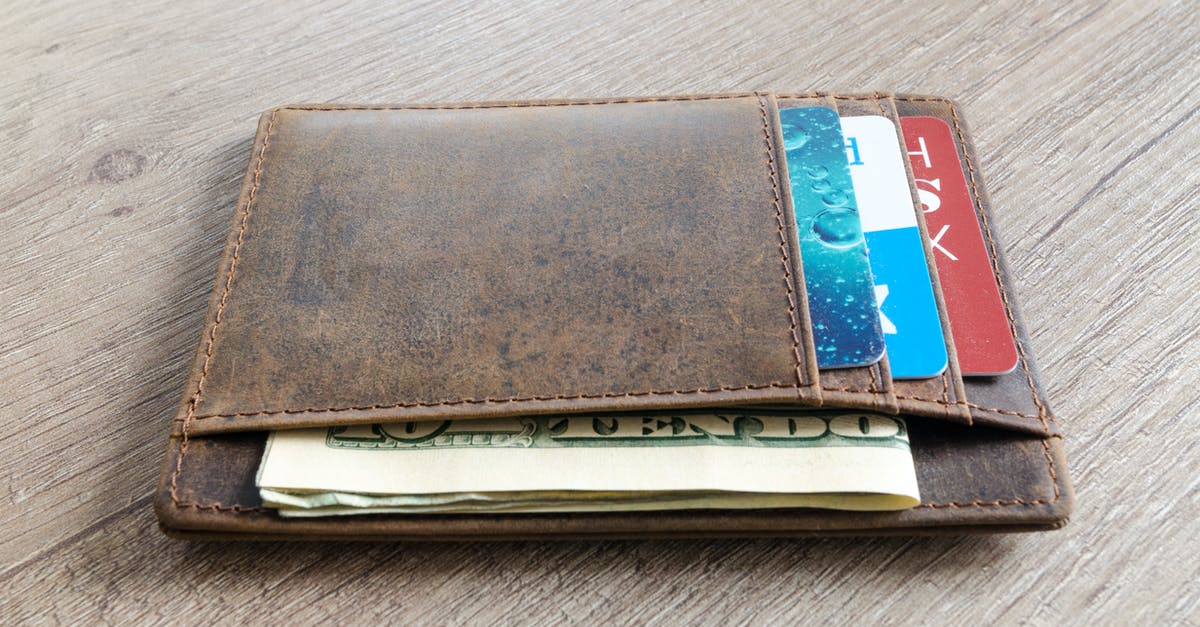 Getting USD cash in Munich on UK cards - Brown Leather Wallet and Us Dollar Banknote