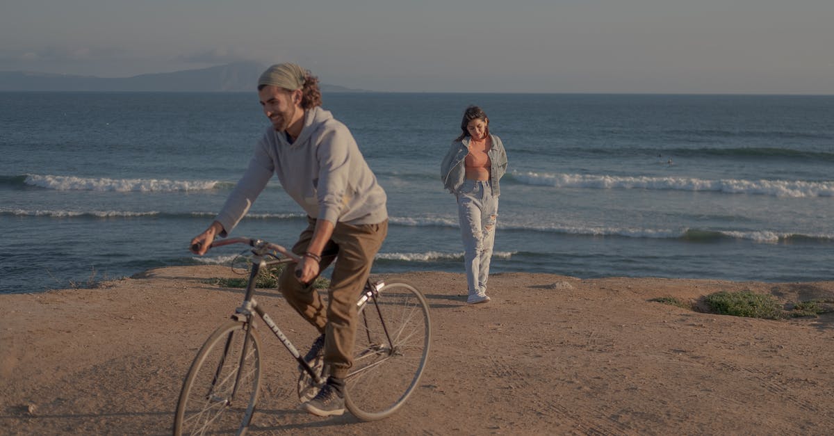 Gibraltar & surroundings to Morocco with a bicycle - Man and Woman Riding Bicycle on Beach