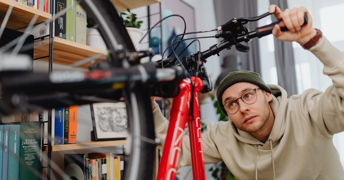 Gibraltar & surroundings to Morocco with a bicycle - Man Repairing Bike at Home