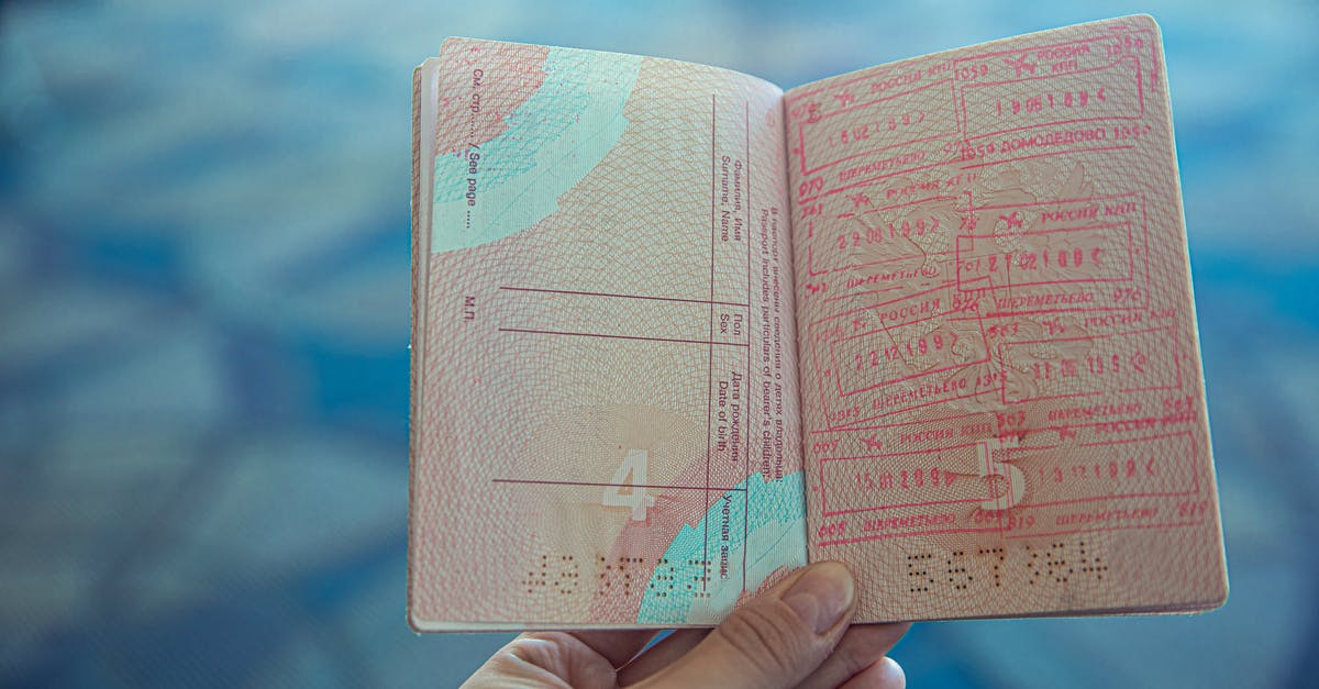 Gibraltar to Spain border passport stamping - Person Holding an Opened Passport