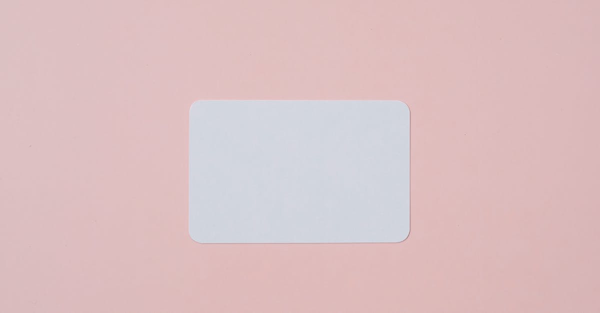 Global ID application with PASS id but pending - White visiting card with empty space for data placed on light pink background