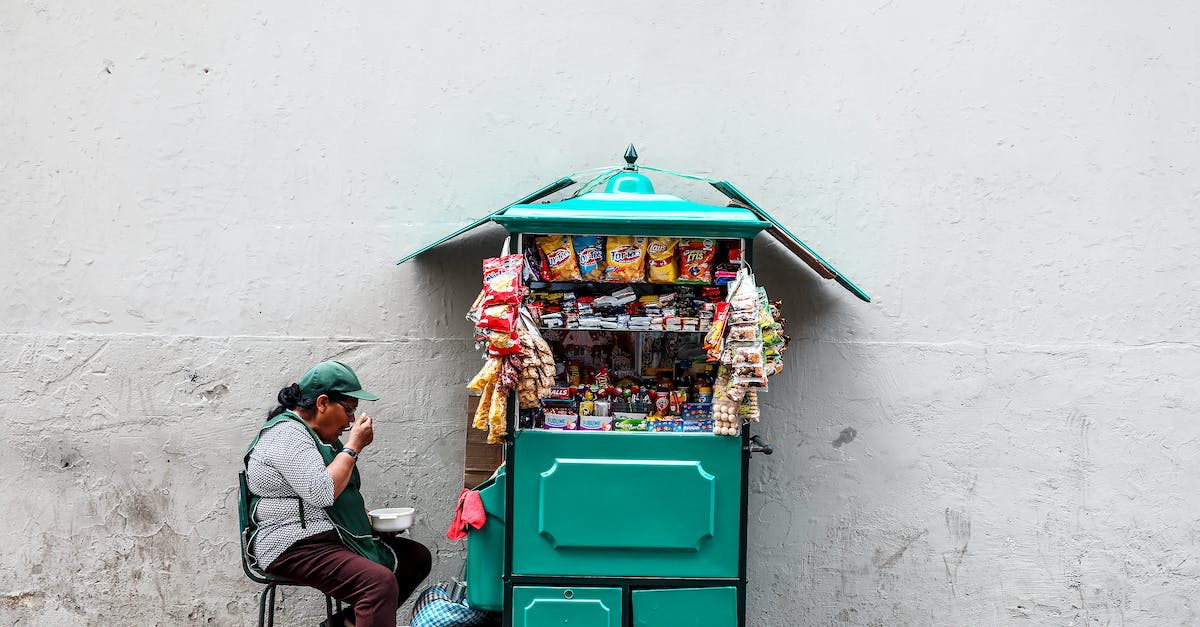 Gluten-free eating in Peru - Woman Eating While Seated Next to Mobile Shop Cart
