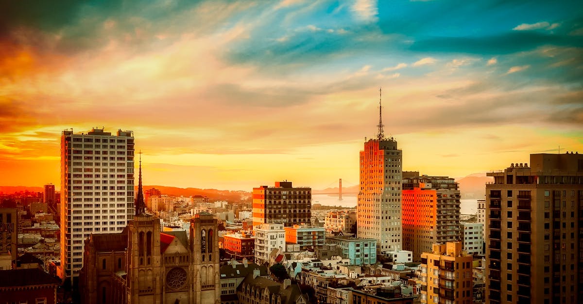 Going from SFO Airport to San Francisco downtown - Buildings Under Cloudy Sky during Sunset