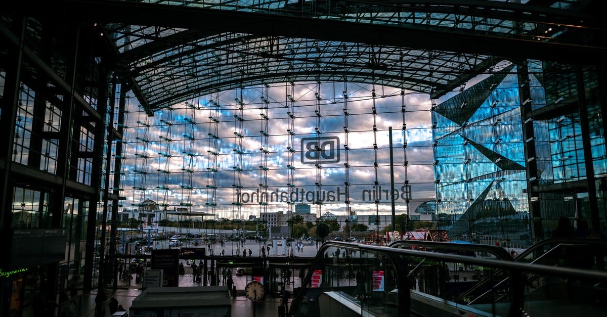 Going through Paris airport customs with 5 cell phones - People Walking on Street