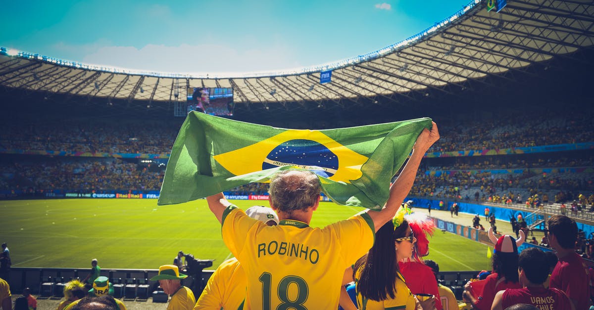 Going to Argentina from Brazil without a Brazilian entry stamp - Man Raising Brazil Flag Inside Football Stadium