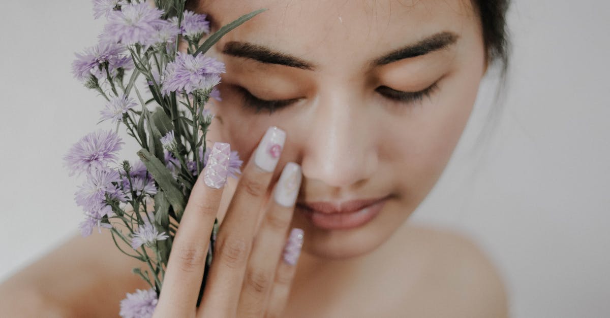 Going to Bali with arachnophobia [closed] - Woman Holding Purple Petaled Flowers